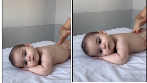 Baby having massage therapy peacefully