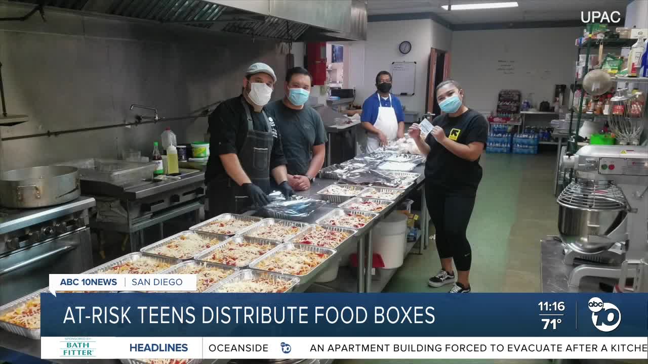 At-risk teens distribute food boxes