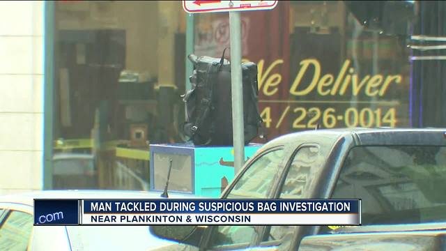 Man tackled by Milwaukee Police after grabbing suspicious package