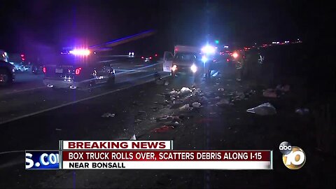 Box truck rolls over, scatters debris along I-15