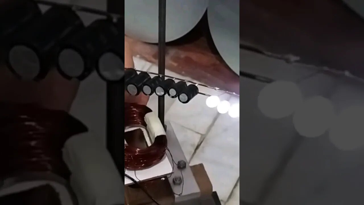 reciprocating magnet-coil-generator lights up LED Bank #shorts