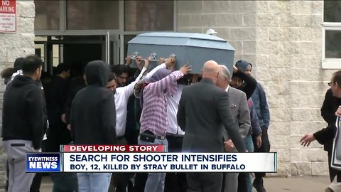 Tears and anger at funeral for teenager hit by stray bullet