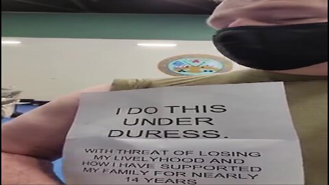 Soldier Gets Vaccinated Holding Sign Saying "I Do This Under Duress"