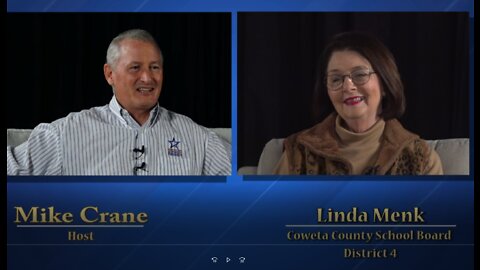 Mike Crane talks with Linda Menk Coweta County School Board Member