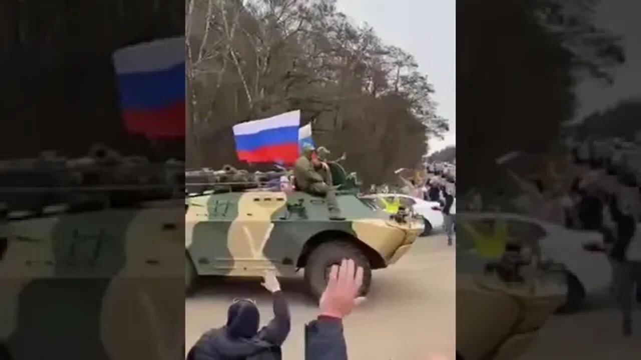 People greeting a Russian military column heading to the front in the Kursk oblast