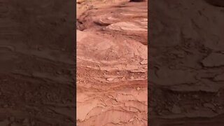 Climbing up rocks at the beach