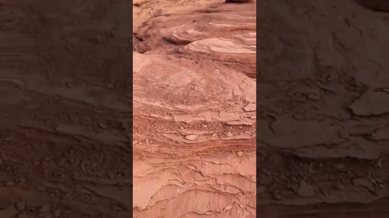 Climbing up rocks at the beach
