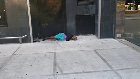 Person sleeping in the street in Murray Hill New York City