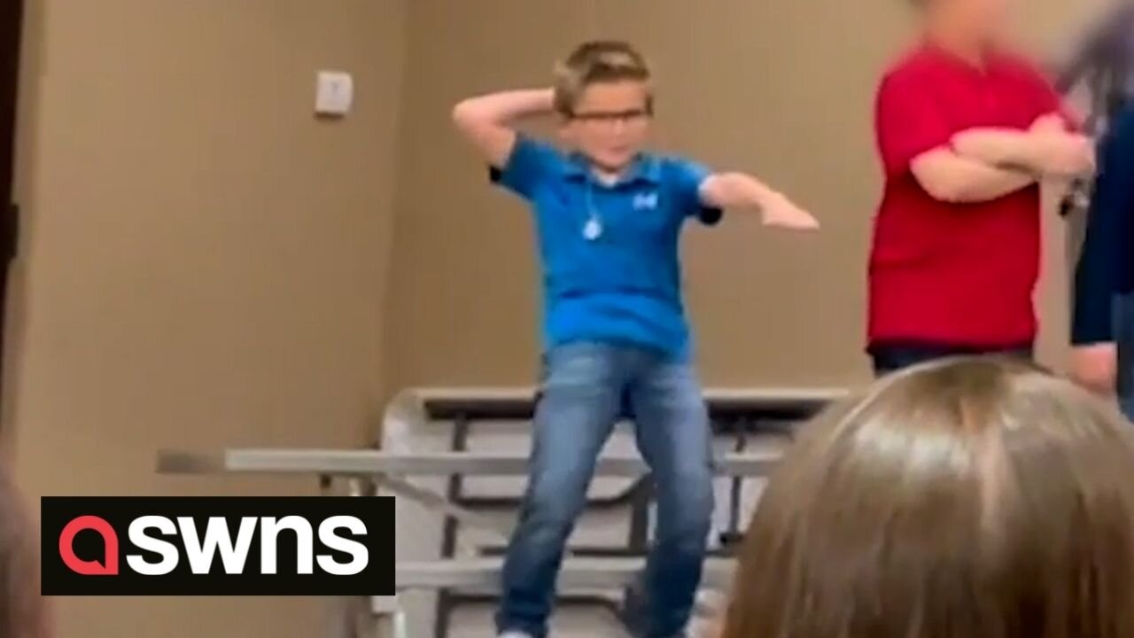 Hilarious moment US boy steals the show with freestyle dance moves at school performance