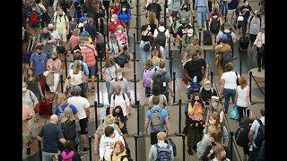 Airline passengers prepare to wait in longer lines