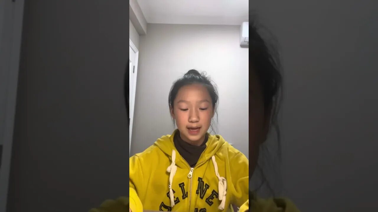 Young Chinese Girl Reads Us An English Story