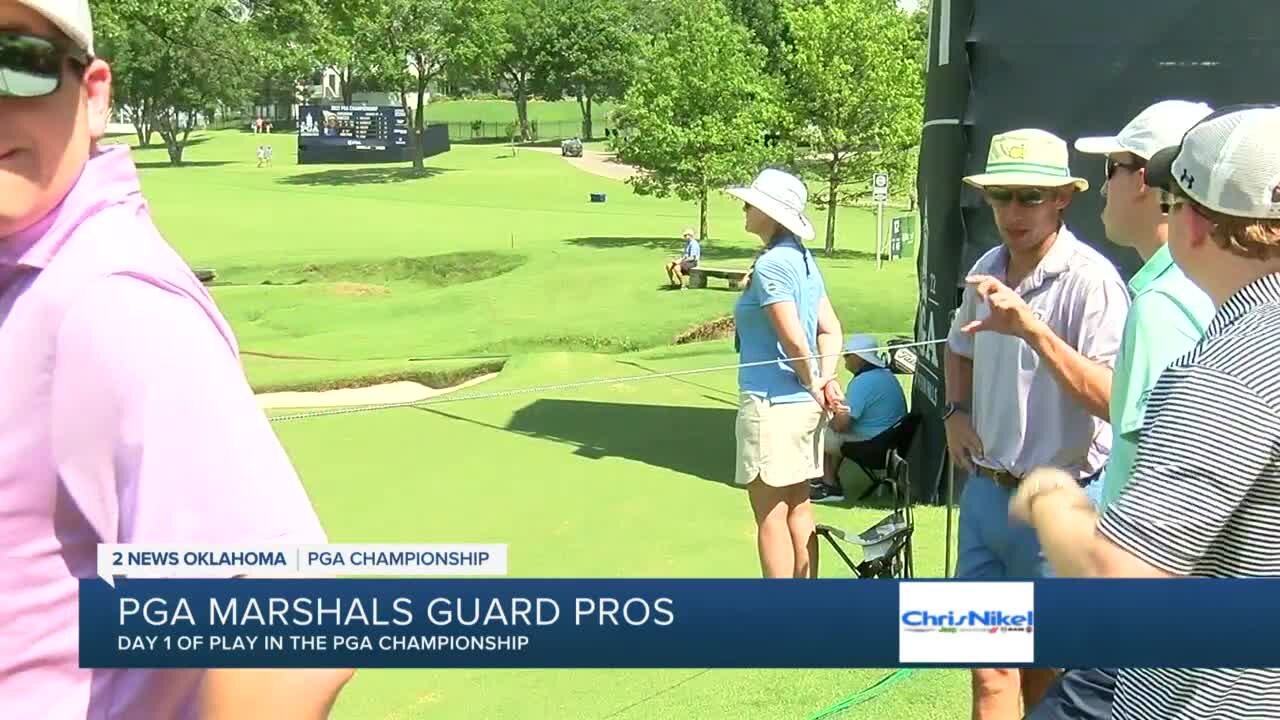 PGA marshals work to protect pro golfers