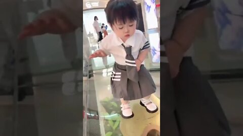 Cute Baby walking on transparent glass