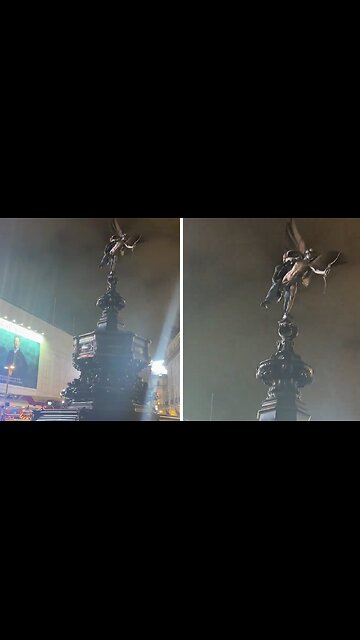 Man get stuck on the Eros statue in Piccadilly Circus