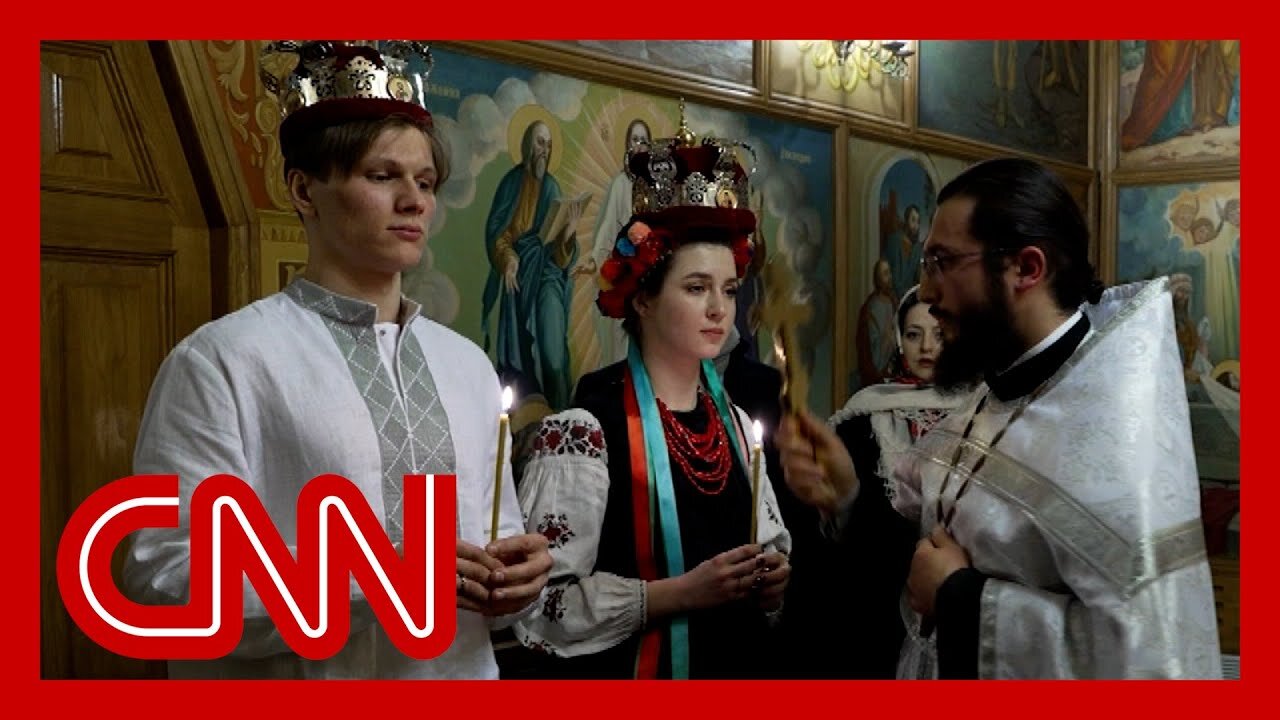 They got married the day Russia invaded. It's been the longest year of their lives