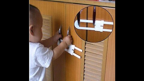 Baby boy arranging the cupboard, very funny