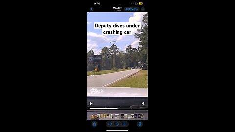 Police officer dives under rolling vehicle