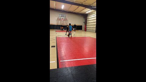 3rd Grader makes a 3 pointer at practice