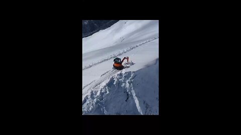 A Man Removes Extra Snow To Prevent Avalanche in Sochi, Russia