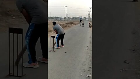 Bowler Stoping the boll