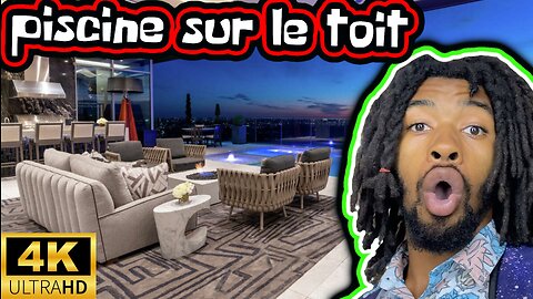 explorez un penthouse avec une piscine sur le toit.