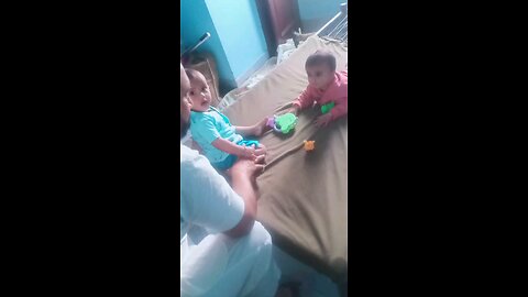 Towing cute baby playing