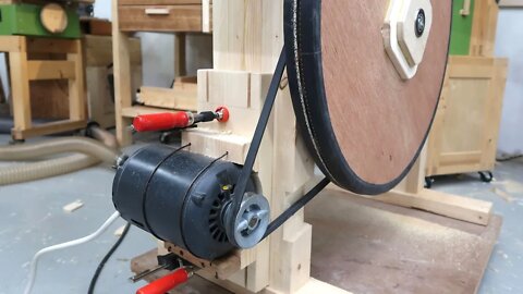 Bandsaw motor mount with coat hanger wire