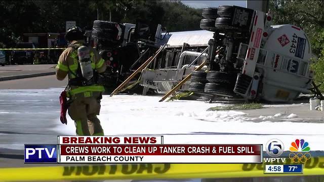 Crews work to clean up taker crash and fuel spill