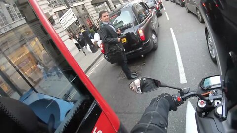 Wholesome Rush Hour Interaction Between Biker And Bus Driver In London