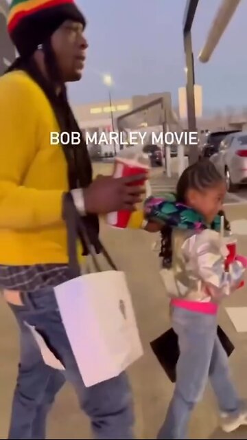 Boosie & his daughter walking out after the Bob Marley movie