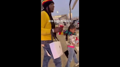 Boosie & his daughter walking out after the Bob Marley movie