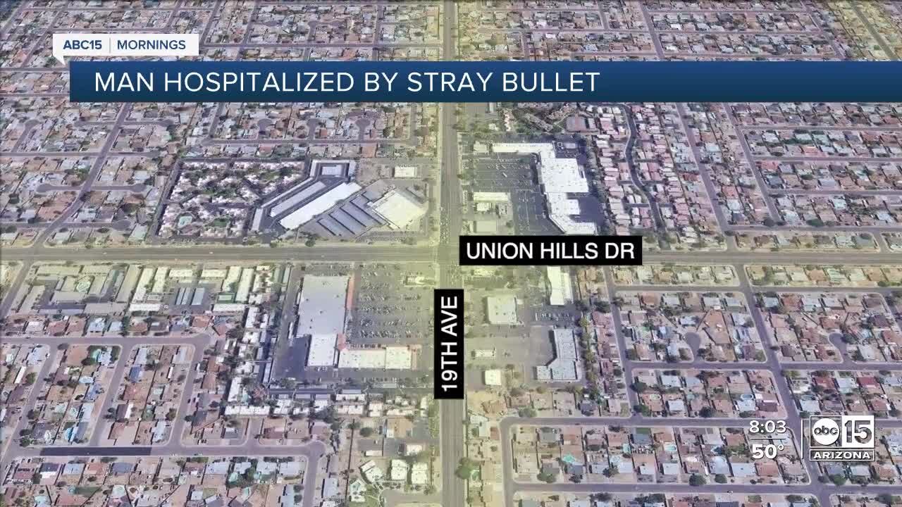 Man hit by stray bullet after gun fight in north Phoenix