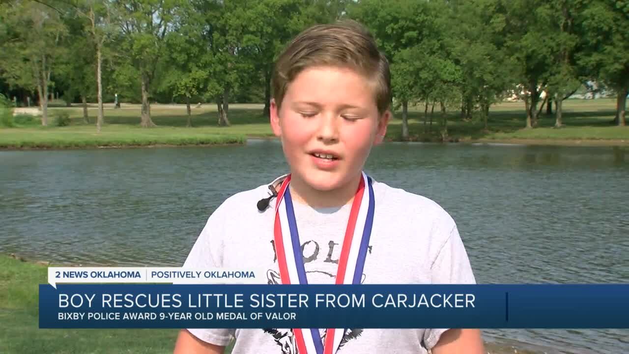 Bicby boy rescues little sister from carjacker