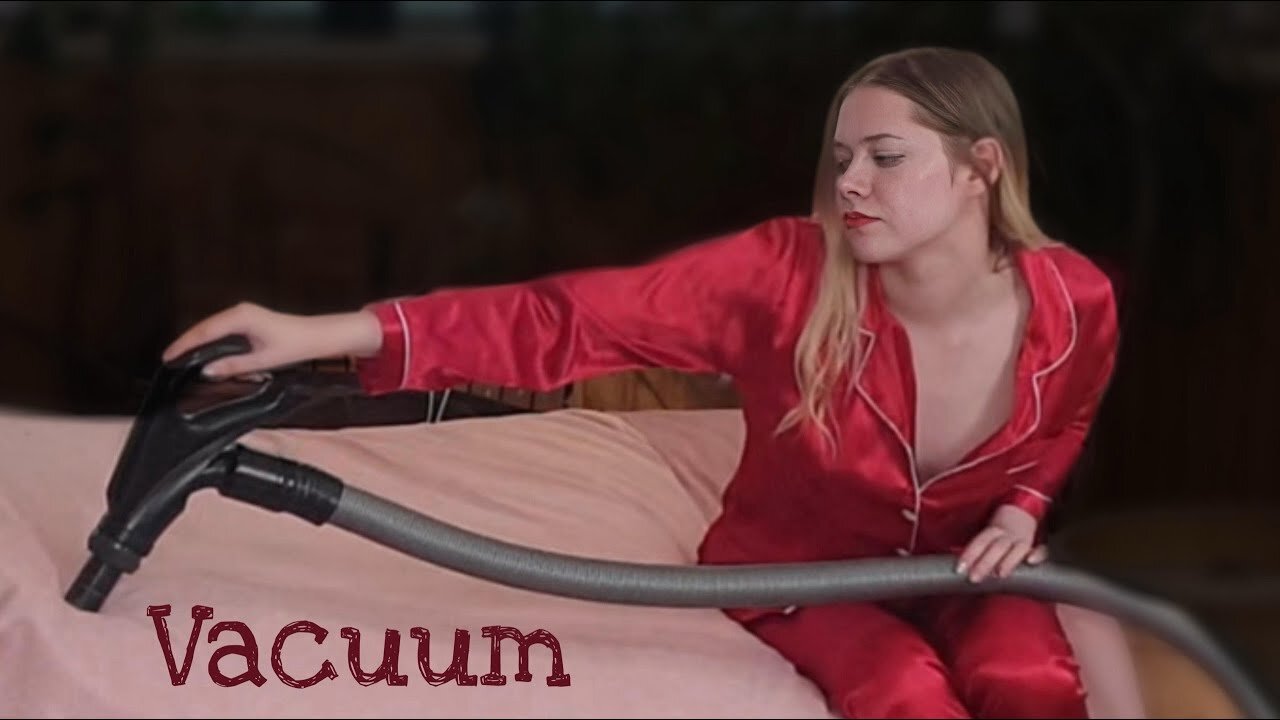 Vacuuming at home in Silk Pajamas