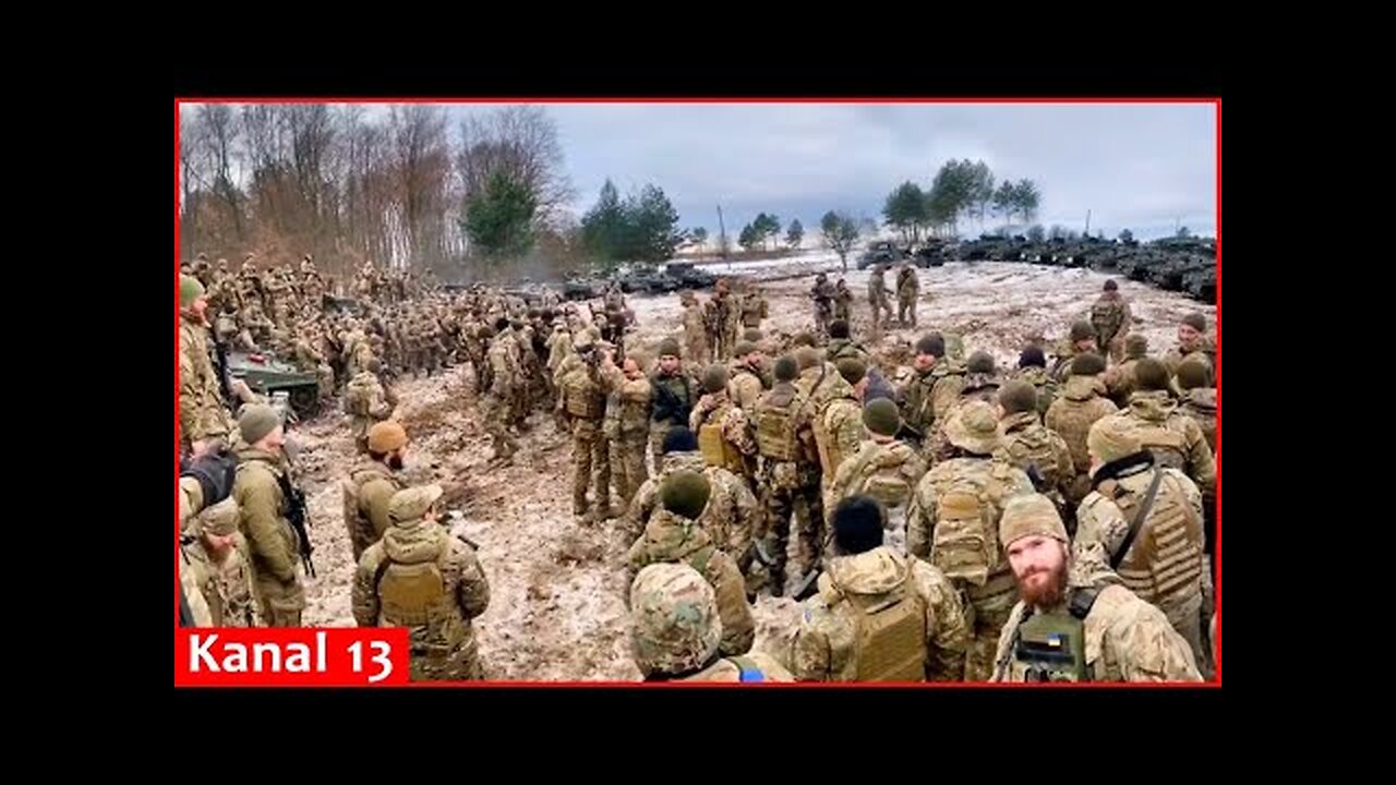 Image of Ukrainian soldiers preparing for battle with a large number of equipment in cold weather