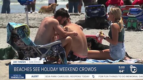 Marine layer, cool breeze don't stop beachgoers