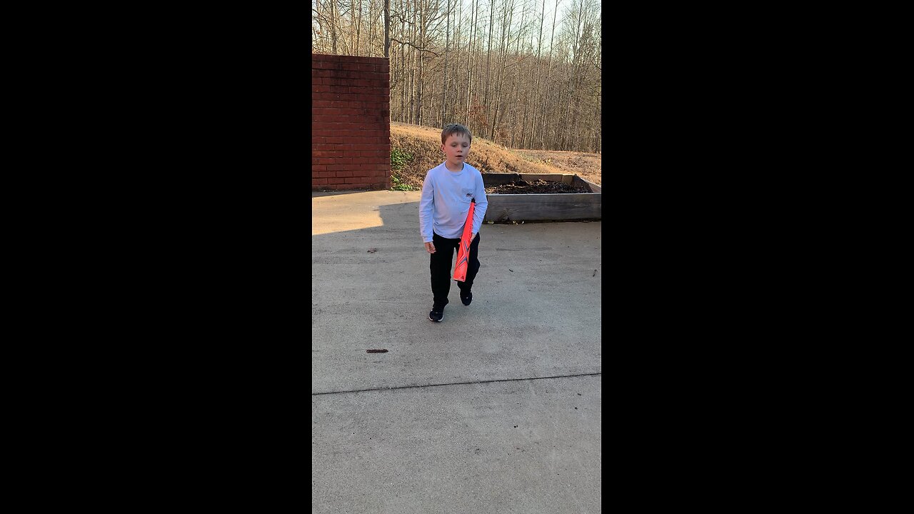 Kid takes batting practice with water balls