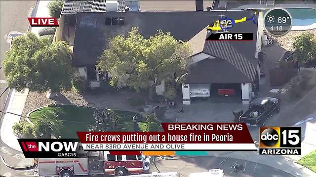 Fire crews battle house fire in Peoria