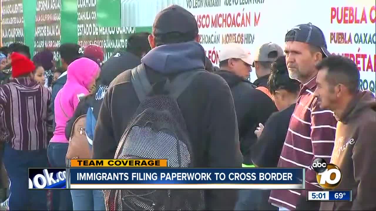 Migrants get paperwork in order ahead of caravan