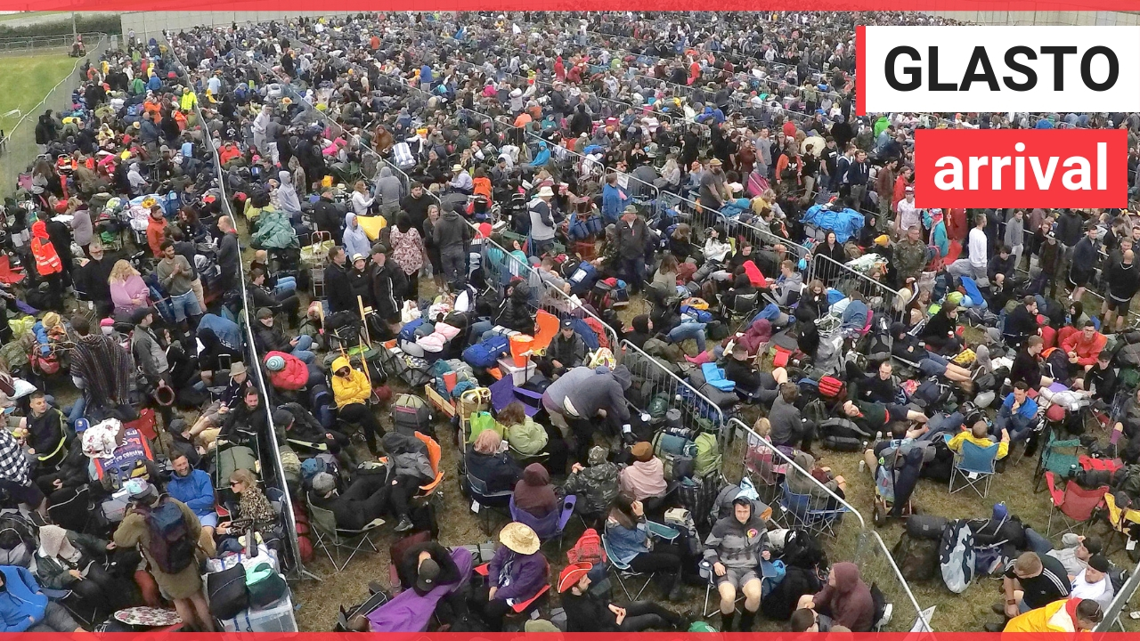 Revellers arrive to mud and grey skies at Glastonbury Festival