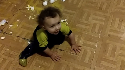 A Girl Hilariously Struggles To Stand Up On The Kitchen Floor