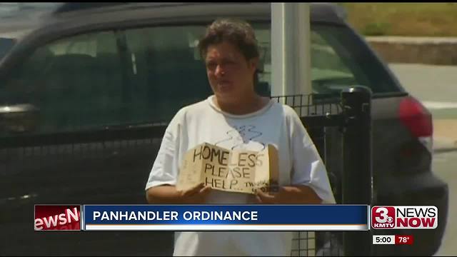 Homeless advocates advise giving Omaha panhandlers food, information