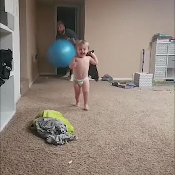 Dad Throws Yoga Ball at Toddler Boy