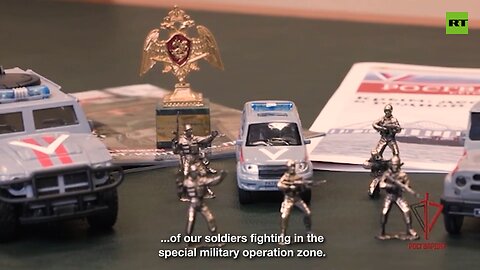 Russian National Guard presents President Macron with toy soldiers