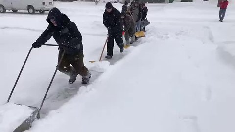 Lomira wrestling team shovels out neighbors in the snow