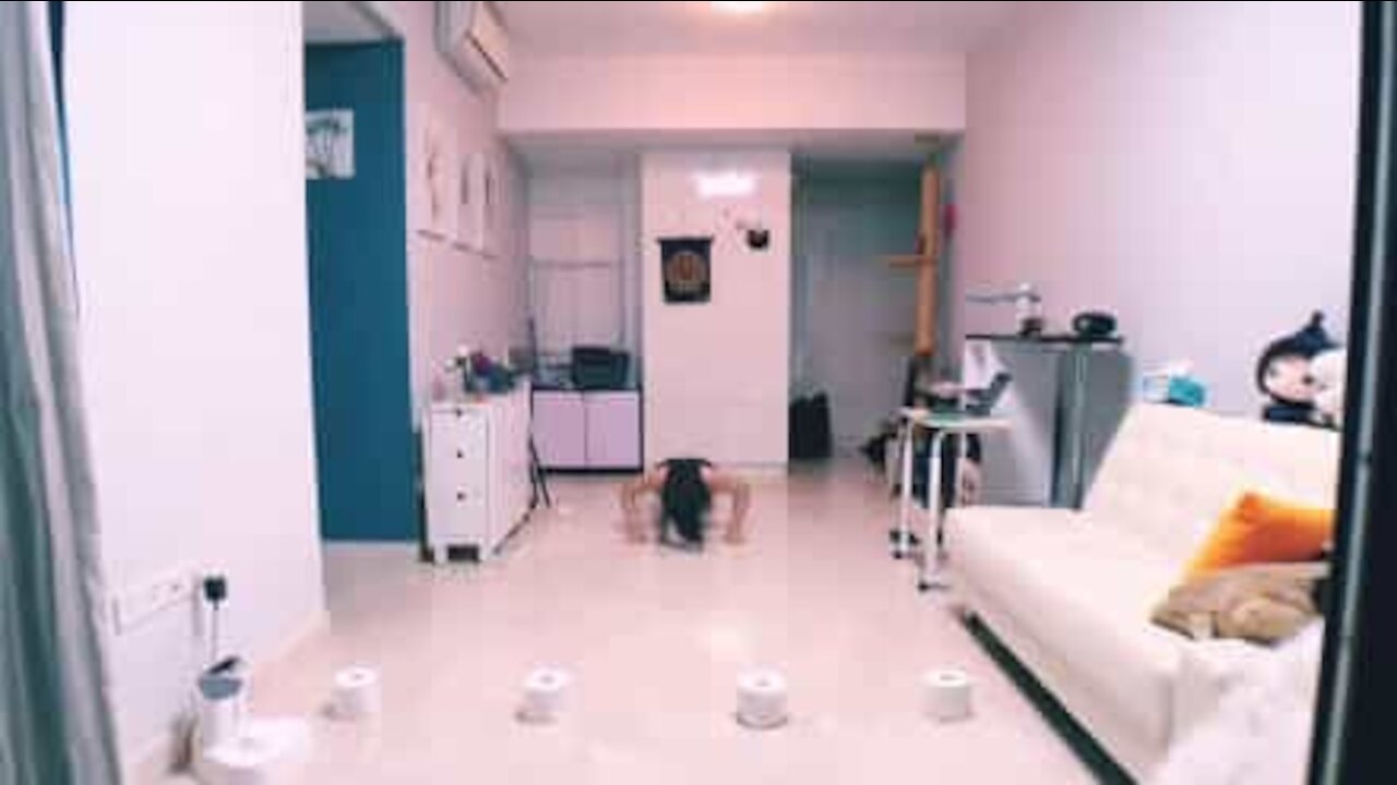Woman's epic home workout with toilet paper