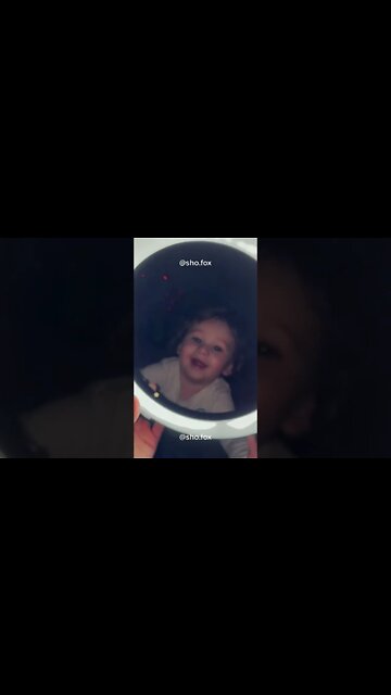 Cute adorable baby child with warm white and pink hat with cute baby girl