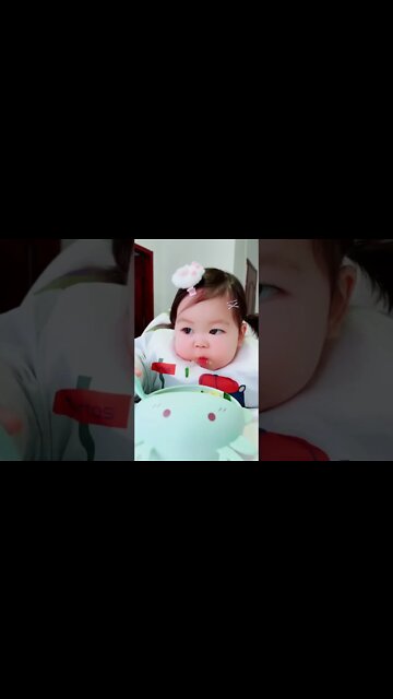 Delicious food 😋 Cute adorable baby child with warm white and pink hat with cute baby girl(3)