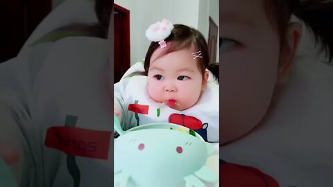 Delicious food 😋 Cute adorable baby child with warm white and pink hat with cute baby girl(3)