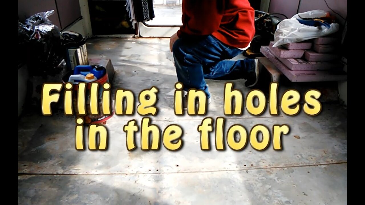 Bus Conversion to RV Life "Snapshot Video" filling in floor holes.